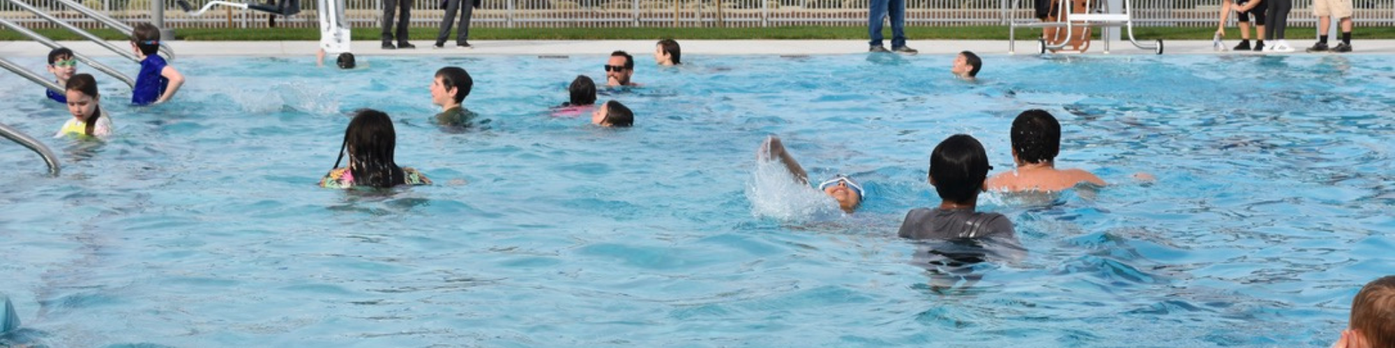 Photo of swimmers at the Feb 7 2026 ribbon cutting of the new Woodland Aquatics Center Pool