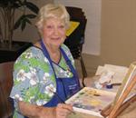Woman sitting down painting