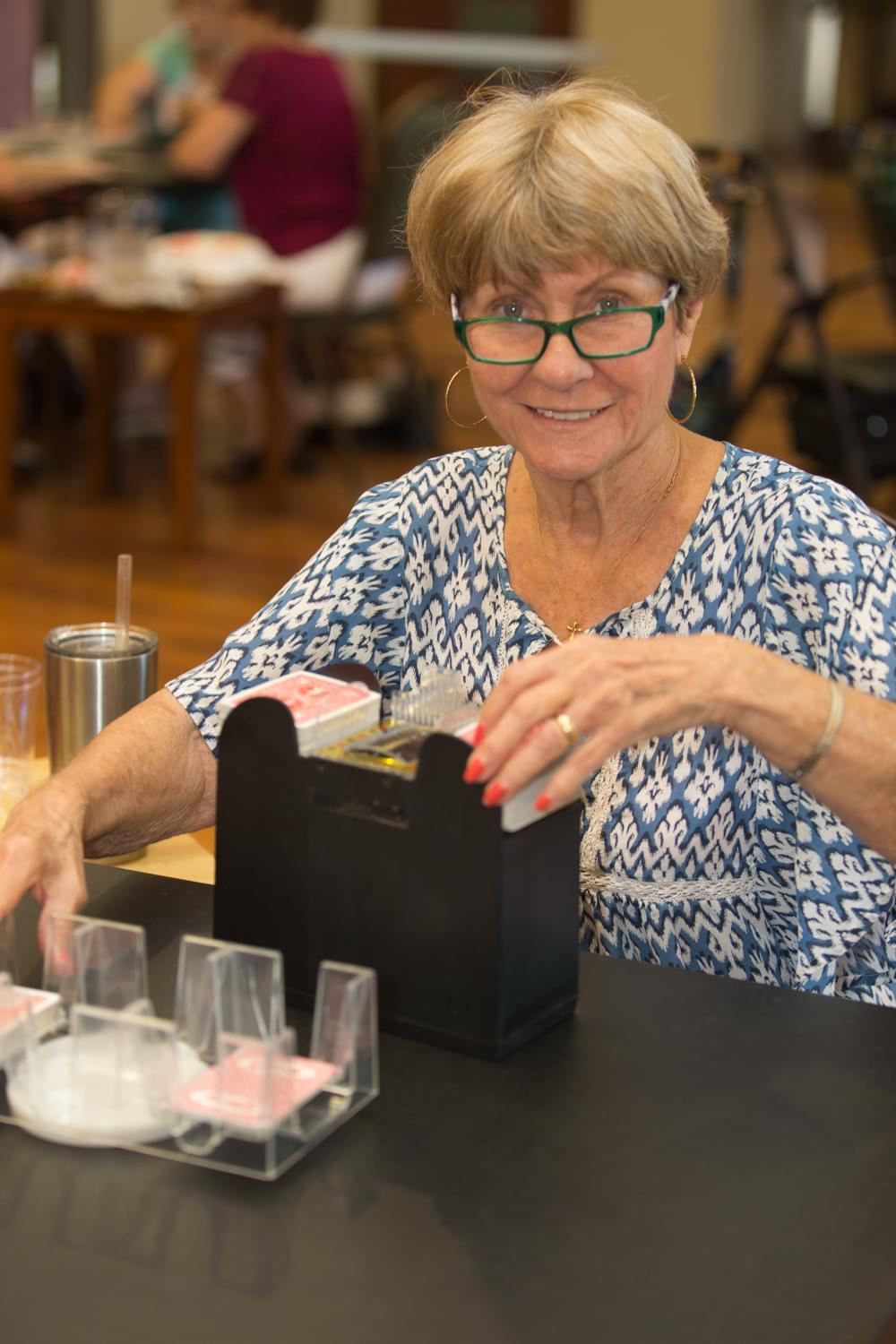 Woman putting away playing cards