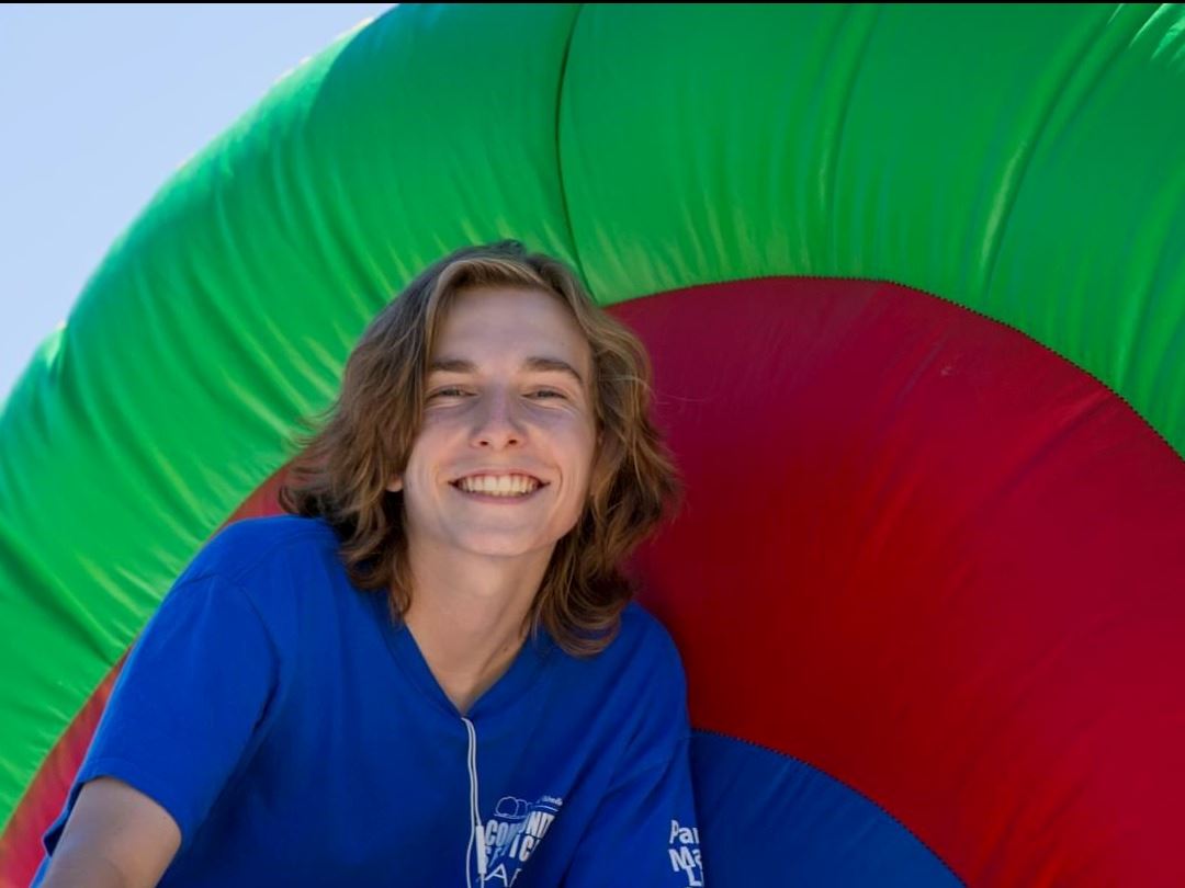 Man on inflatable slide